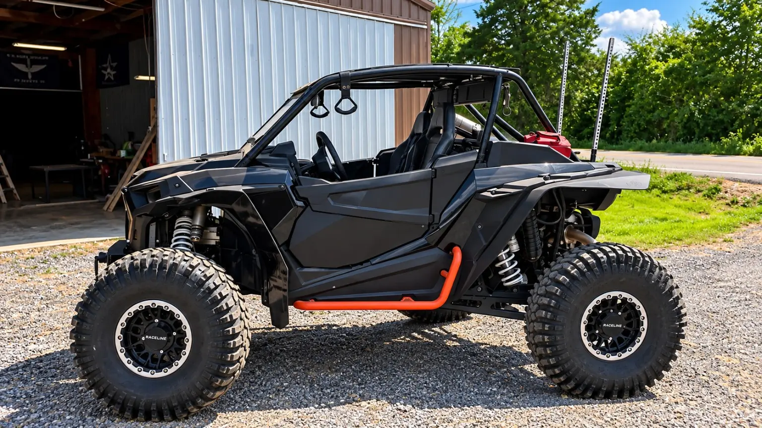 Garrett Guetersloh's black 2021 RZR Turbo S with orange rock sliders